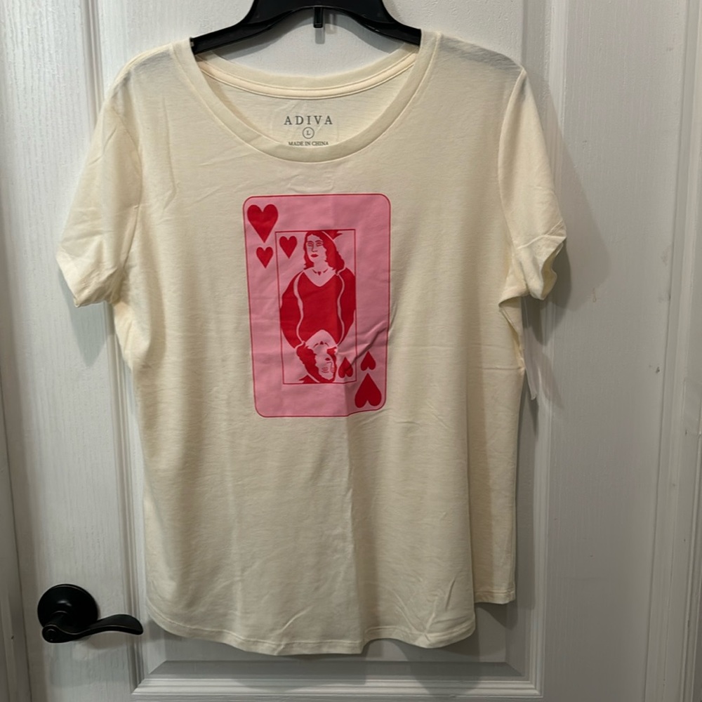 NWT tee. Lovely cream color with pink graphic. Nice soft material. Large